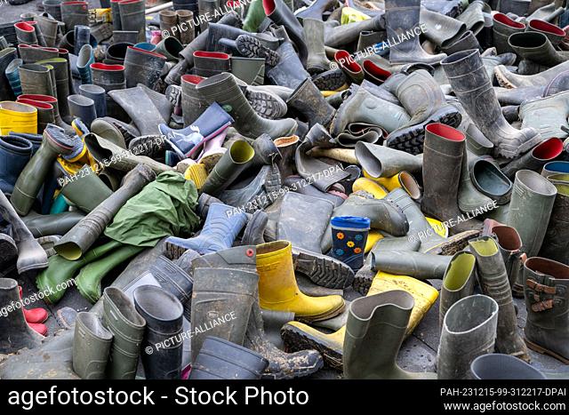 12 December 2023, Bavaria, Munich: More than a thousand rubber boots lie in front of the FDP district office. In a state-wide day of action