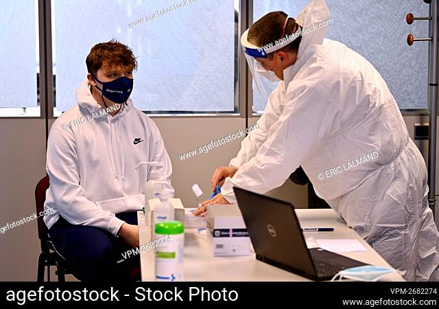 Illustration shows an employee being tested with a rapid test, at Agape company in Brussels, Friday 26 March 2021. The launch of rapid tests is part of the new...