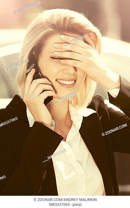 Young fashion business woman calling on cell phone outdoor