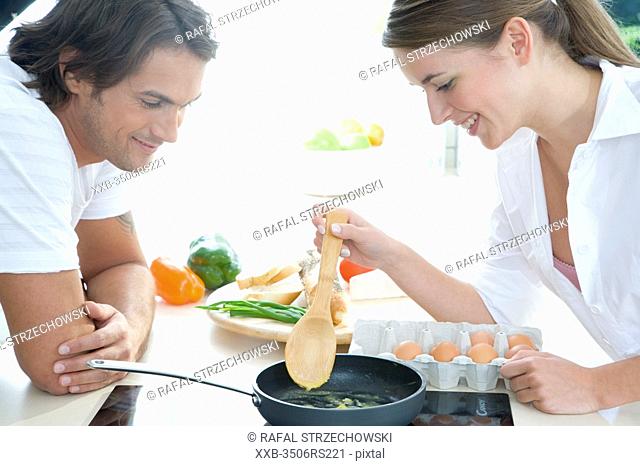 couple making breakfast
