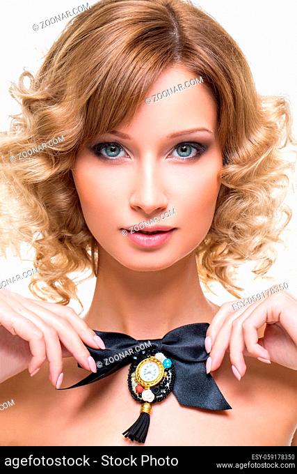 Beautiful blond young woman with black ribbon bow. Beauty shot on white background. Isolated. Copy space