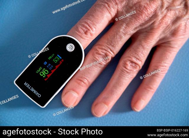 Oximeter attached to the index finger to measure the oxygen level in the blood