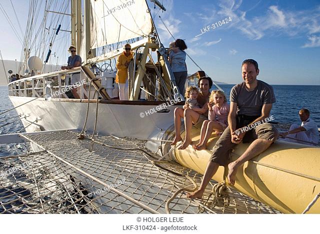Young Family on bowsprit of sailing cruiseship Star Flyer Star Clippers Cruises, near Bastia, Corsica, France