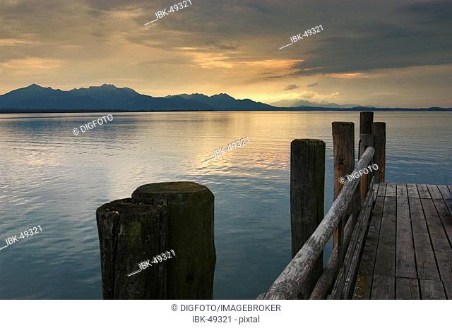 Landing stage at dusk, lake Chiemsee, Bavaria, Germany
