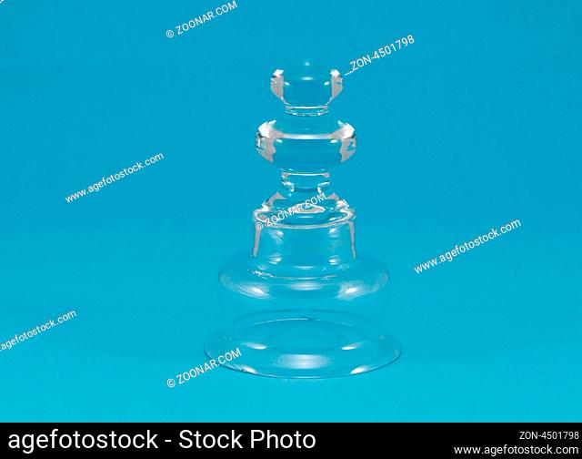 beautiful curvy house glass decoration dish on blue background
