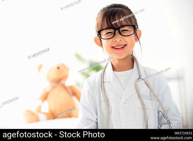 The little girl dressed as a doctor