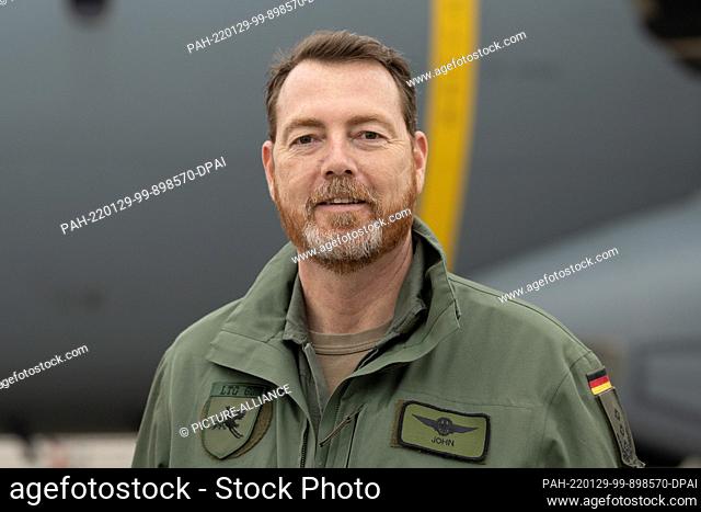 29 January 2022, Hessen, Calden: Colonel Christian John, Commodore Lufttransportgeschwader 62 of the German Air Force, stands in front of an Airbus A400M of the...