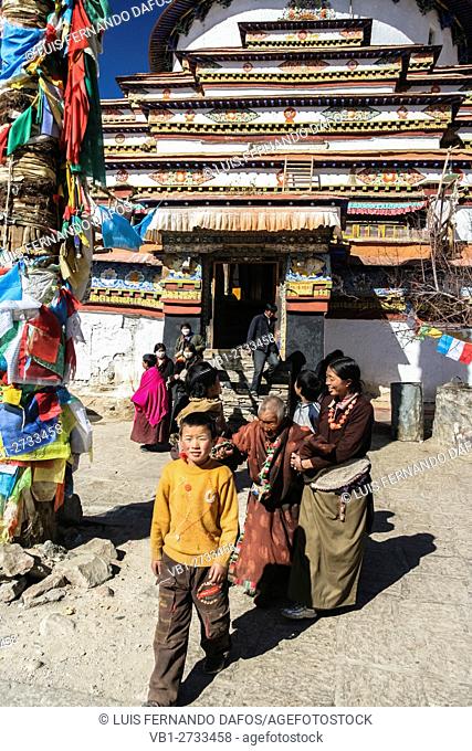 Tibetan pilgrims at the Kumbum chorten of Pelkor Chode Monastery, Gyantse, Tibet