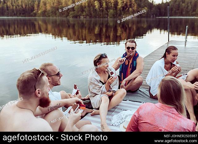 Friends relaxing at lake