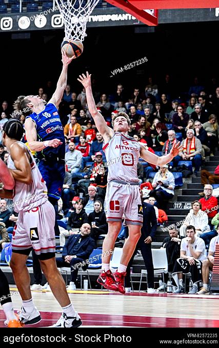 Mons' Conley Garrison and Antwerp's Jo Van Buggenhout pictured in action during a basketball match between Antwerp Giants and Mons Hainaut
