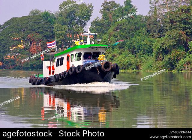 Thailand river shipping. Traffic of vessels and small private boats on the river