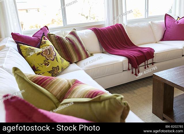 Beautiful abstract of inviting colorful couch sitting area and table