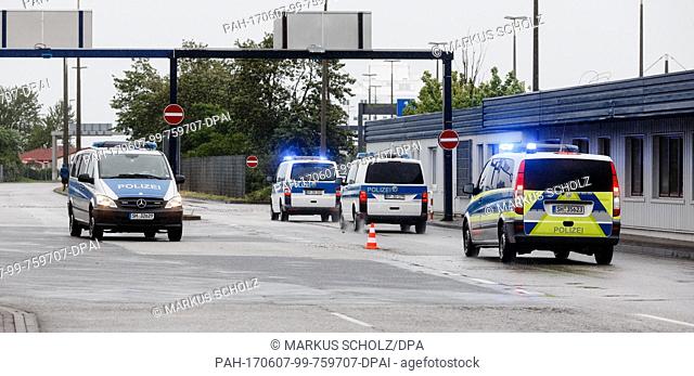 Police vehicles block access to the ferry harbour in Puttgarden, Germany, 7 June 2017. The ferry service between Puttgarden and Rodby (Denmark) was suspended in...