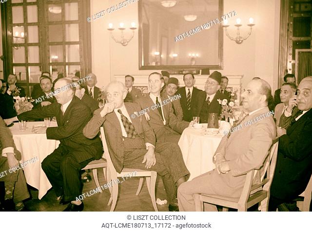 Reception at King David Hotel, Oct. 16, 1940 for Egyptians Ibrahim el-Mazuri & Table group listening to speech being made by Egyptian guests, Jerusalem