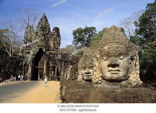 carved faces at entrance to Ankor Thom, Ankor, Cambodia