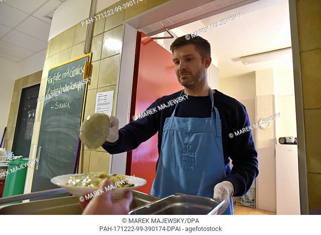 The head of the infirmary for the homeless, Thorsten Eikmeier, standing at the meal serving counter of the infirmary for the homeless in Hamburg, Germany