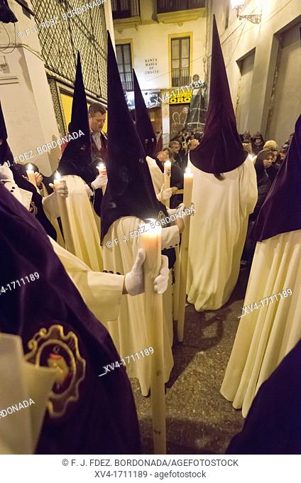 Penitents of Macarena brotherhood in Seville during Holy week celebration, Andalusia, Spain, Europe