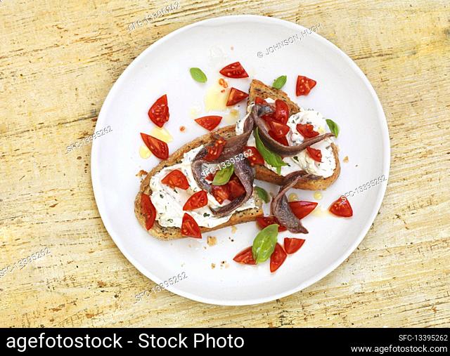 Spanish anchovy salad on cream cheese bread