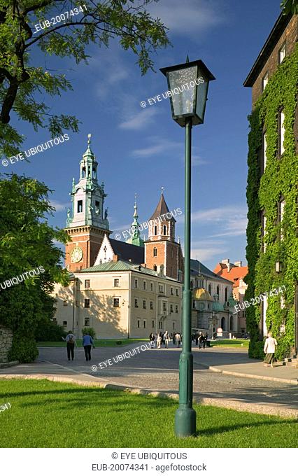 Road with lamppost and pedestrians leading up to Wawel Cathedral on Wawel Hill
