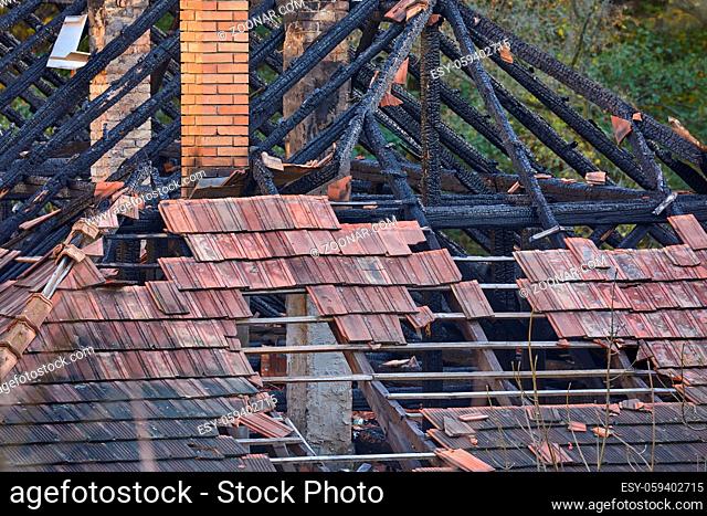 Roof of a house damaged in fire