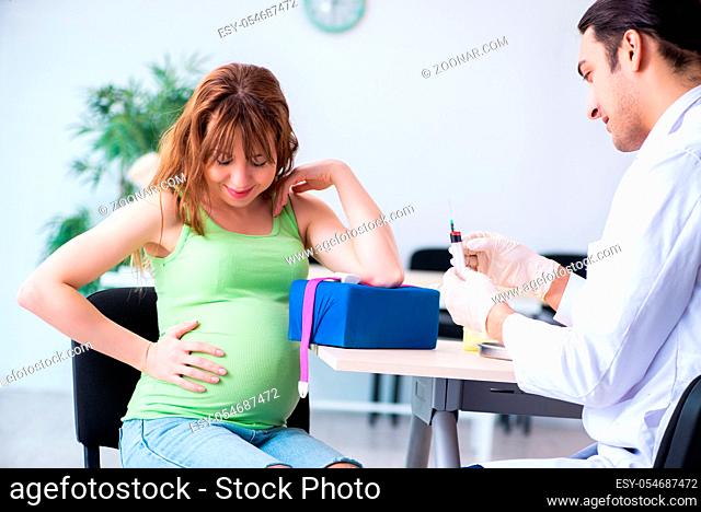 The young pregnant woman in blood transfusion concept