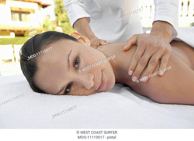 Woman Receiving a Massage head and shoulders