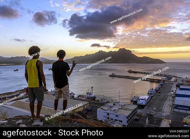Young Men Admiring the Sunset on Monte Cara and Porto Grande Bay seen from Fortim del Rei, Mindelo, Sao Vicente, Cape Verde Islands, Africa