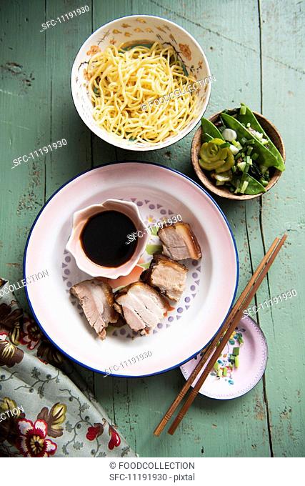 Pork with soy sauce, vegetables and noodles