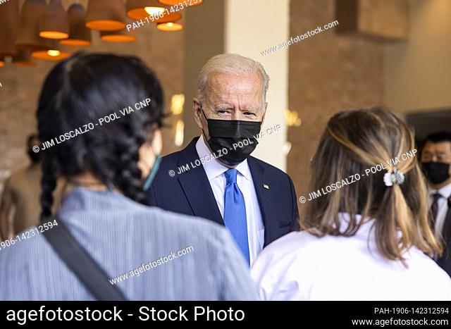 United States President Joe Biden speaks to workers as he picks up tacos during a visit to Las Gemelas Restaurant in Washington, DC, USA, 05 May 2021