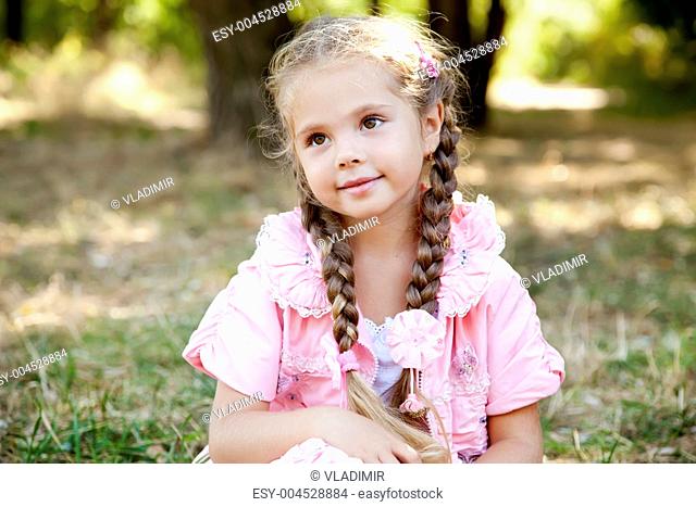 Cute little girl at outdoor in fall