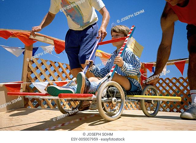 Boy in go-cart at starting gate