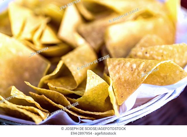 A bowl of tortilla corn chips, close up
