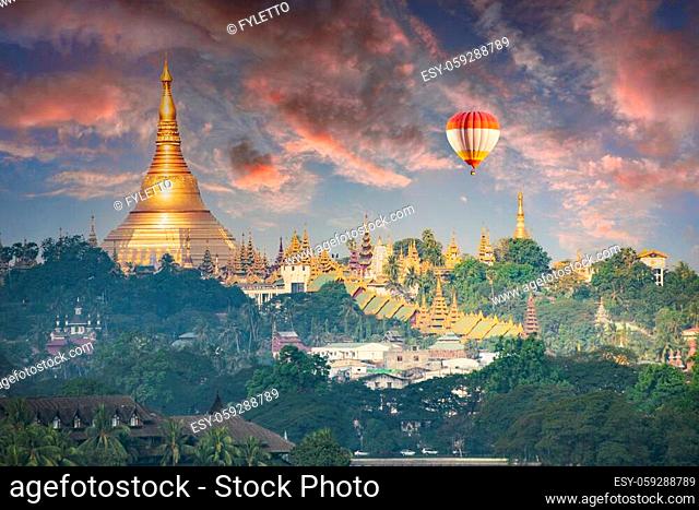 Ballon flying over Shwedagon Pagoda, the most sacred golden Buddhist temple in Myanmar. It is located on the Singuttara hill in Yangon, Myanmar