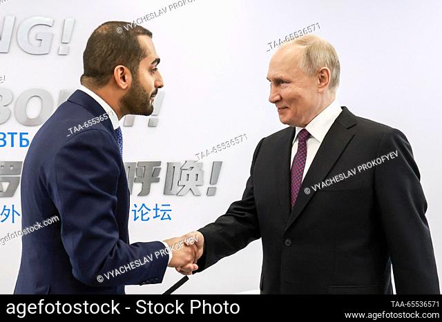 RUSSIA, MOSCOW - DECEMBER 7, 2023: Oman's Minister of Culture, Youth and Sports, Crown Prince Theyazin bin Haitham Al Said (L) and Russia's President Vladimir...
