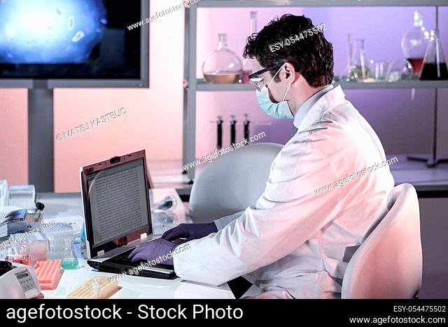 Scientist working in the corona virus vaccine development laboratory research facility. Corona virus pandemic concept. Development of virus treatment drug