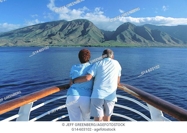 Senior couple on vacation on a cruise ship. Auau channel, near Maui