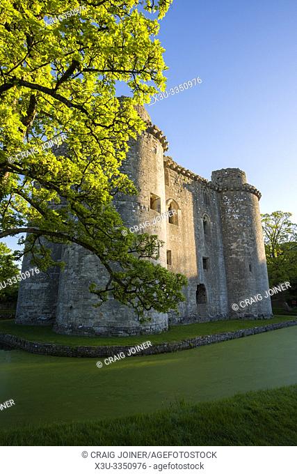 Nunney Castle and moat in the village of Nunney, Somerset, England