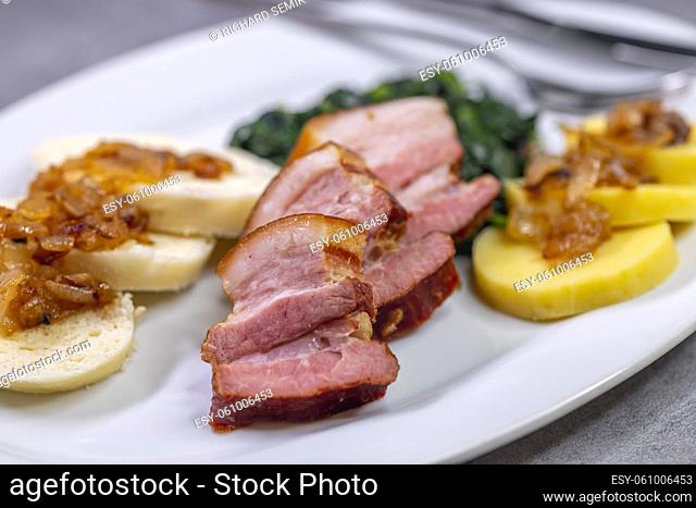 smoked flank with potato and bread dumplings and spinach