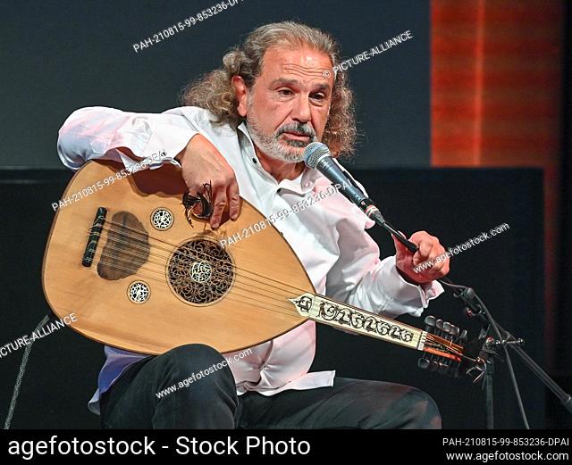 13 August 2021, Brandenburg, Neuhardenberg: Rabih Abou-Khalil, musician, with an oud (short-necked lute), at the concert for the summer programme of Schloss...