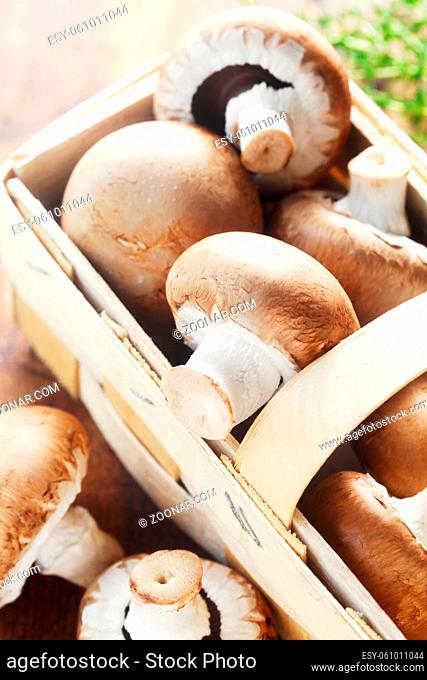 Raw Mushrooms In A Basket