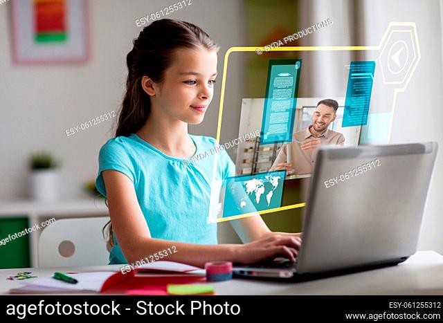 student girl having online class on laptop at home