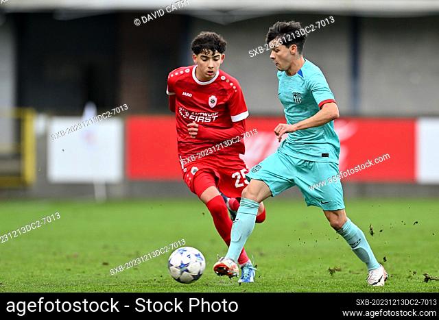 Youssef Hamdaoui (25) of Antwerp defending on Joan Anaya (2) of Barcelona during the Uefa Youth League matchday 6 game in group H in the 2023-2024 season...