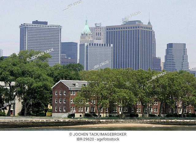 USA, United States of America, New York City: Governors Island, Fort Jay and Castle Williams in the East River. Skyline of South Manhattan