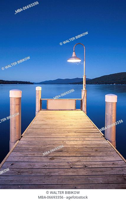 USA, New York, Adirondack Mountains, Lake George, boat pier, evening
