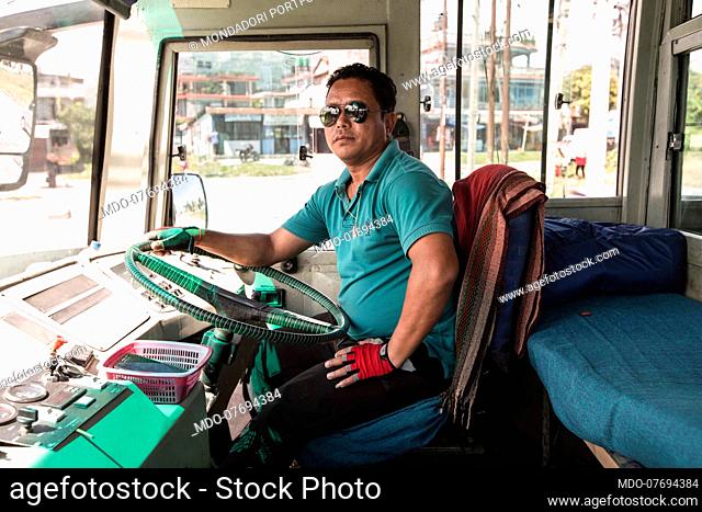 Portrait of a bus driver. Pokhara (Nepal), August 19th 2019