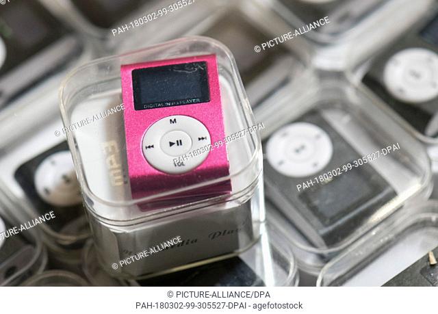 28 February 2018, Germany, Frankfurt: German customs seized fake MP3 players at a secret shipping's storage at an industrial estate