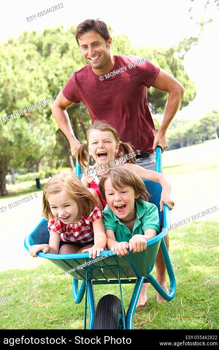 father, playing, siblings, wheelbarrow
