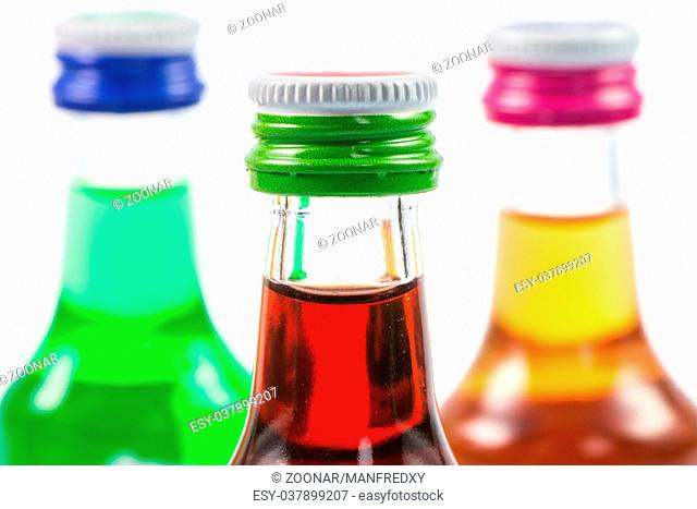 Various isolated liqueur bottles with party drinks