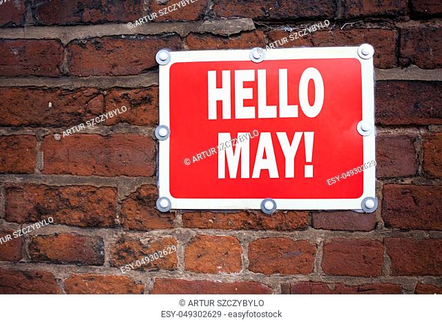 Hand writing text caption inspiration showing Hello May. Spring concept meaning Criminal hacker security prevention written on old announcement road sign with...