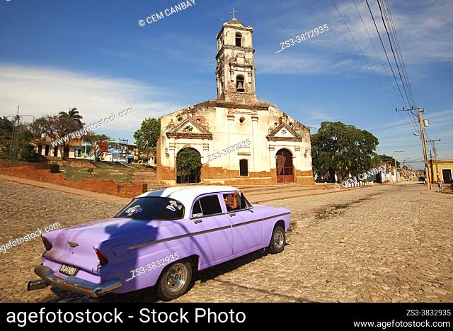 Old American car in front of Santa Ana Church-Iglesia De Santa Ana at the historic center, Trinidad, Sancti Spiritu Province, Cuba, West Indies, Central America